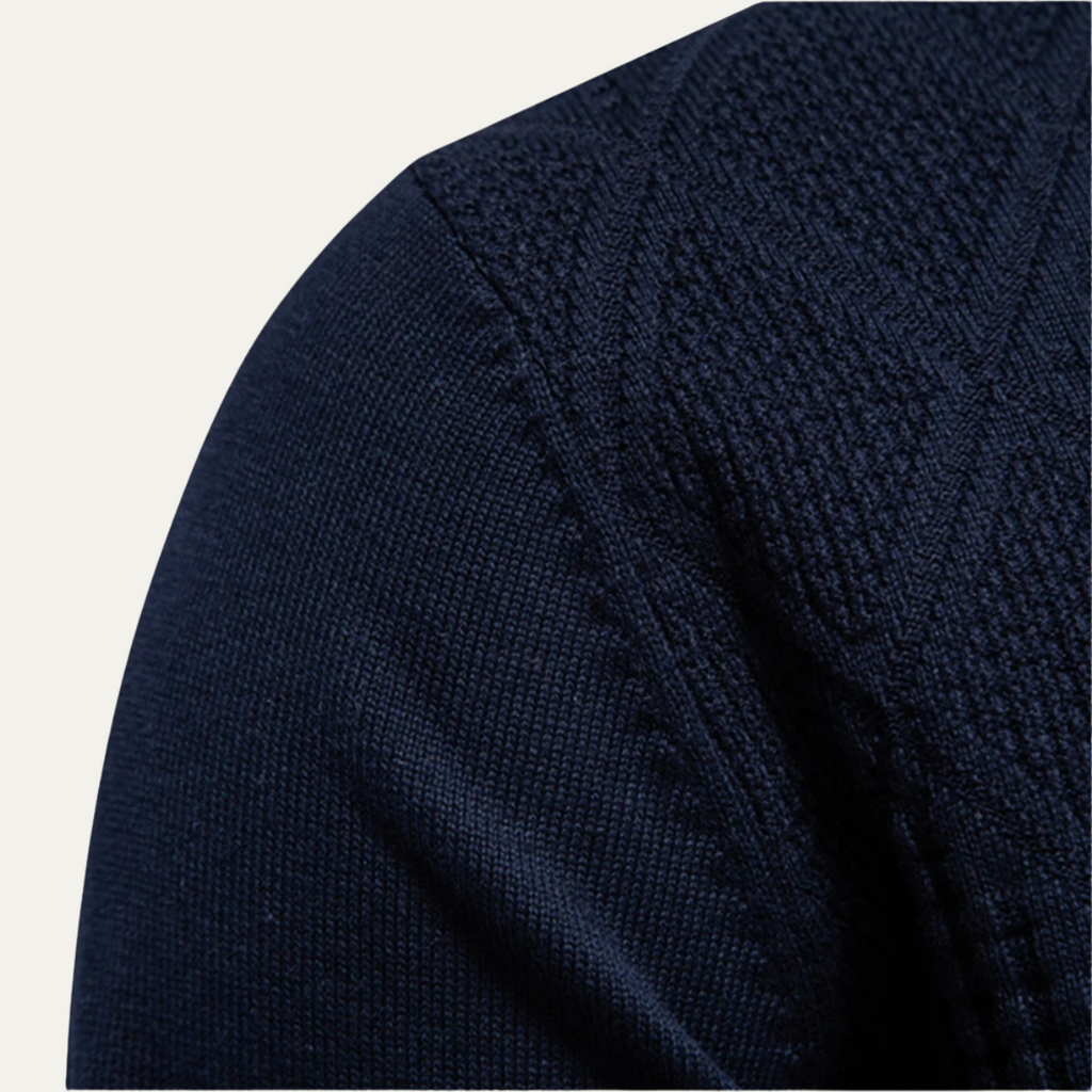 Men's navy diamond-knit polo sweater sleeve close-up with textured fabric