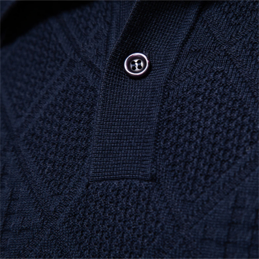 Men's navy diamond-knit polo sweater close-up of button placket and buttons