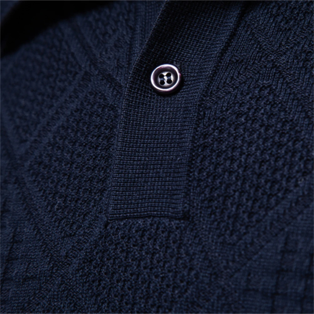 Men's navy diamond-knit polo sweater close-up of button placket and buttons