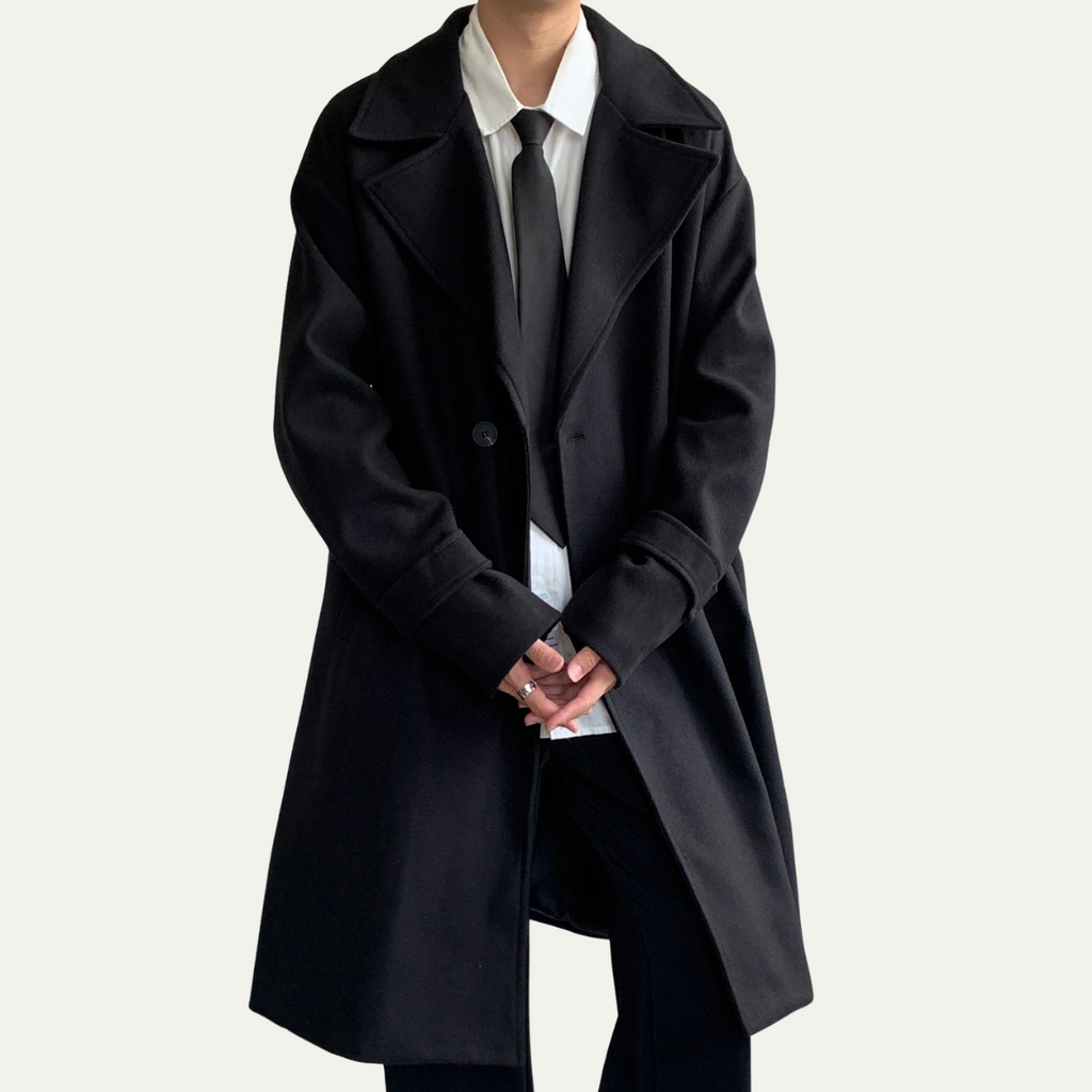 Black wool overcoat with pointed lapels and flap pockets