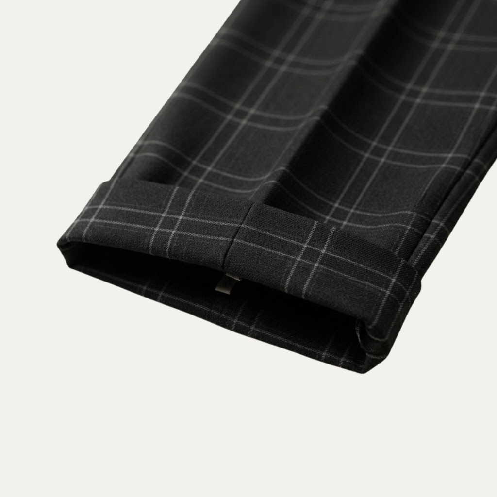 Checked fabric cuff and hem of men's slim-fit pants, dark plaid with light stripes