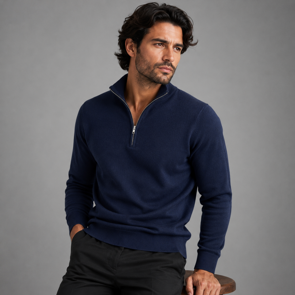 Men's quarter-zip mock neck sweater in navy on model, ribbed cuffs