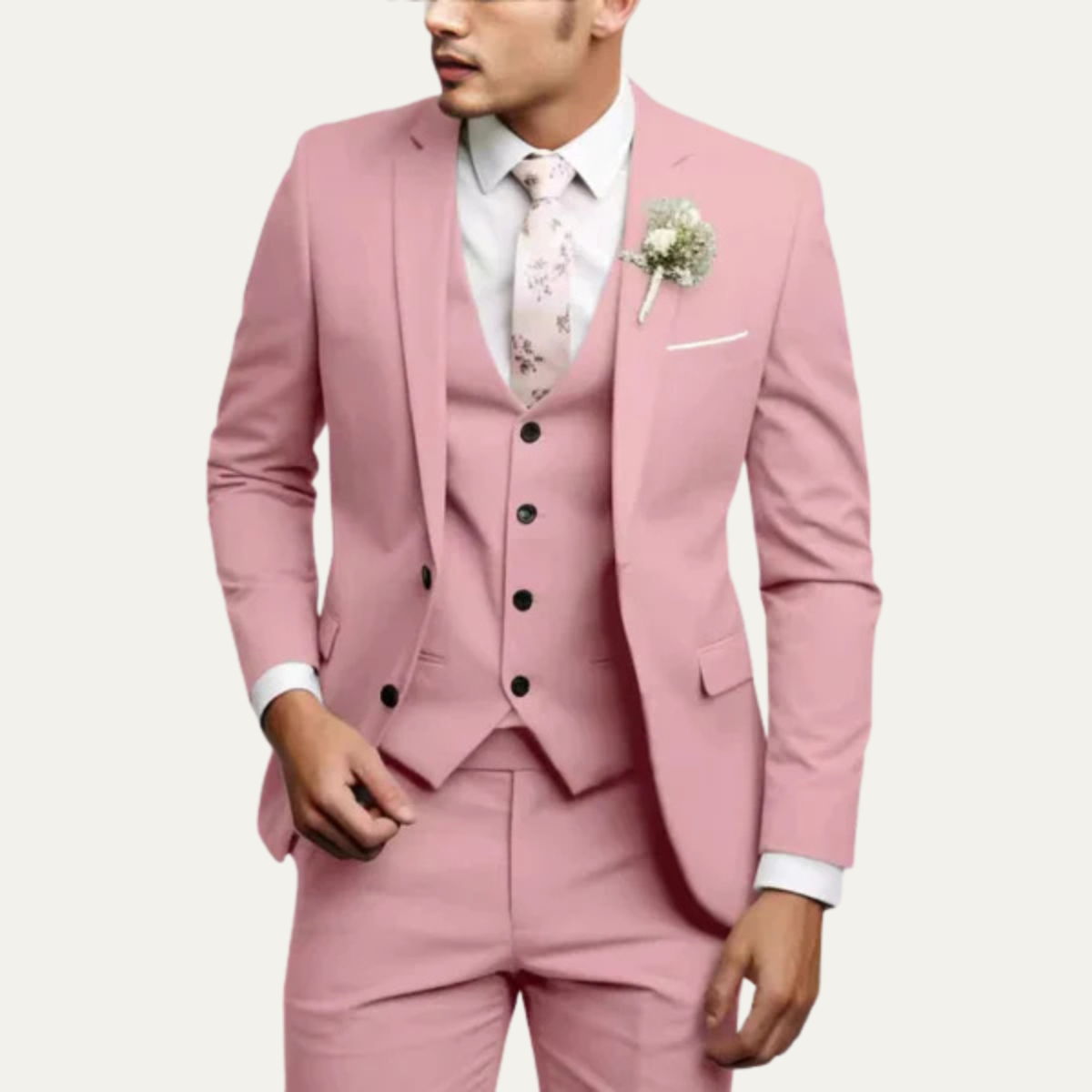 Men's 3-piece slim-fit suit set in light pink with jacket, vest, and matching trousers.