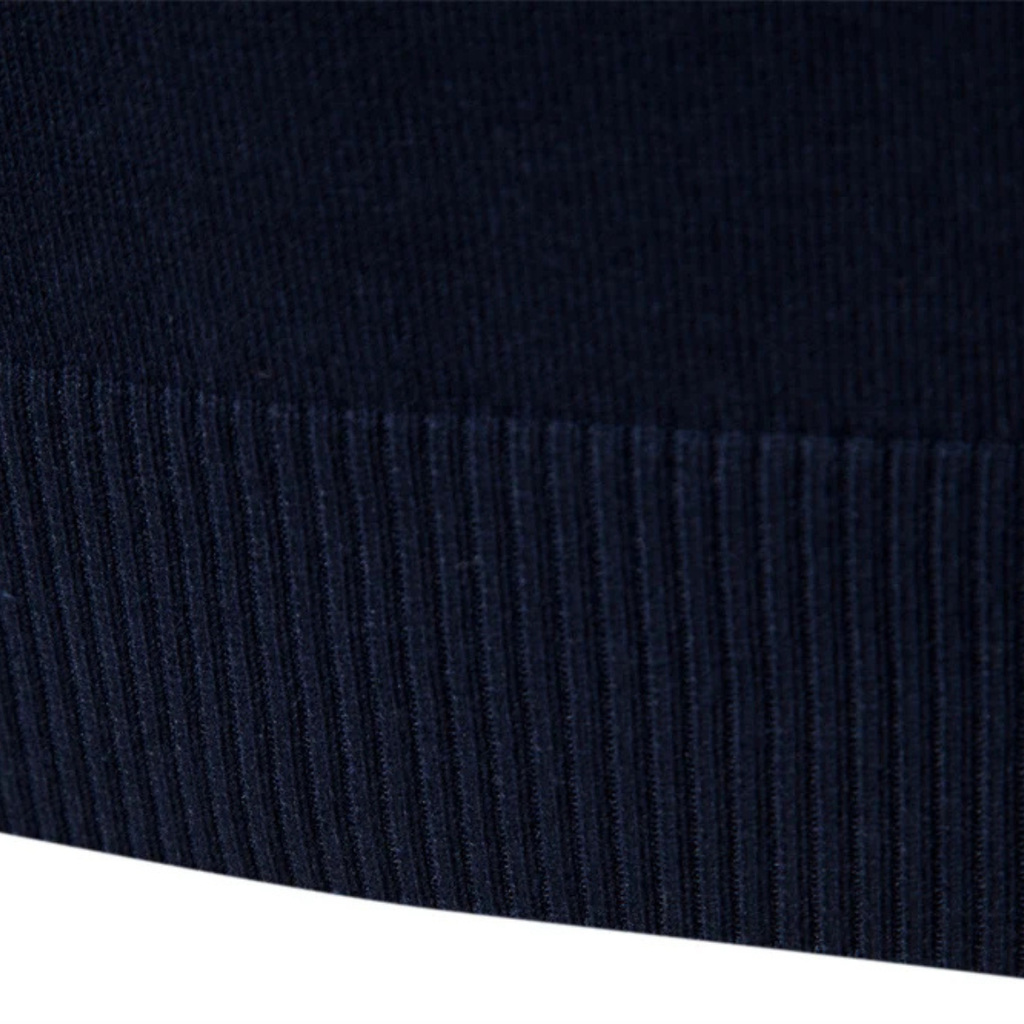 Navy ribbed sweater hem with vertical knit texture