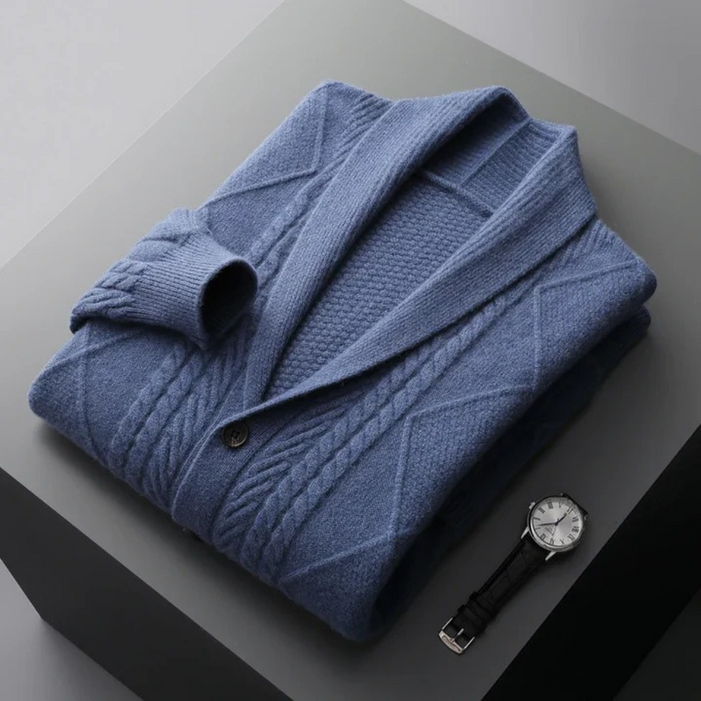 Folded blue men's wool button cardigan with cable knit texture