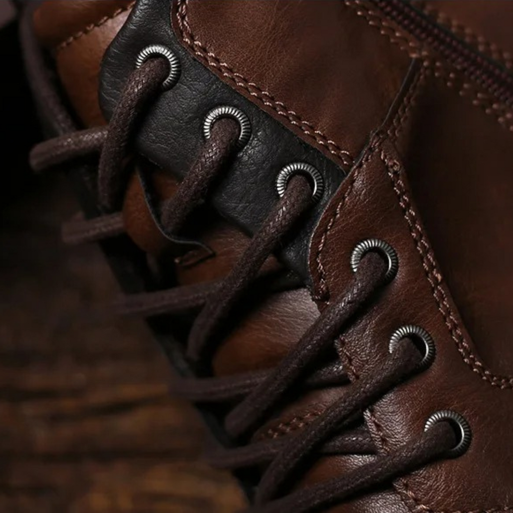 Dark brown leather combat boots with thick laces and metal eyelets