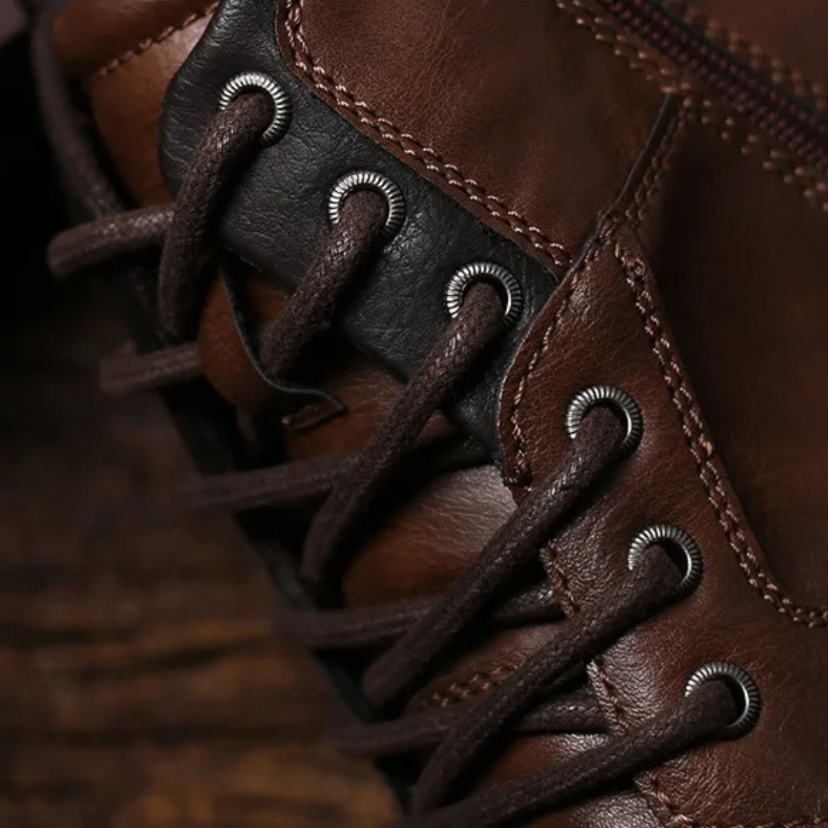 Dark brown leather combat boots with thick laces and metal eyelets