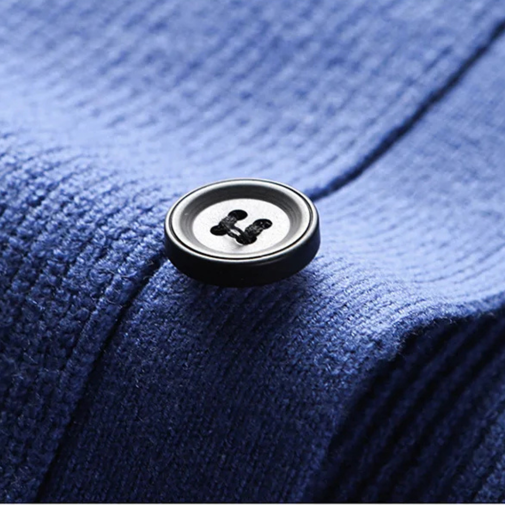 Blue knit sweater vest button placket with round black buttons