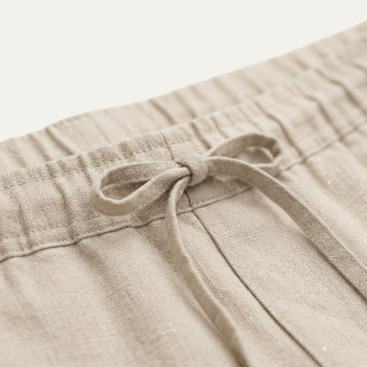 Men’s linen elastic waist pants, light beige, drawstring and waistband close-up