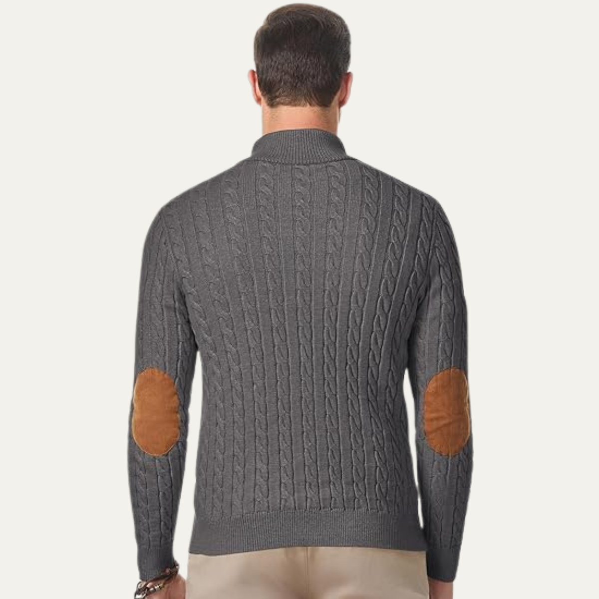 Men's dark gray cable-knit sweater back with tan elbow patches and ribbed hem