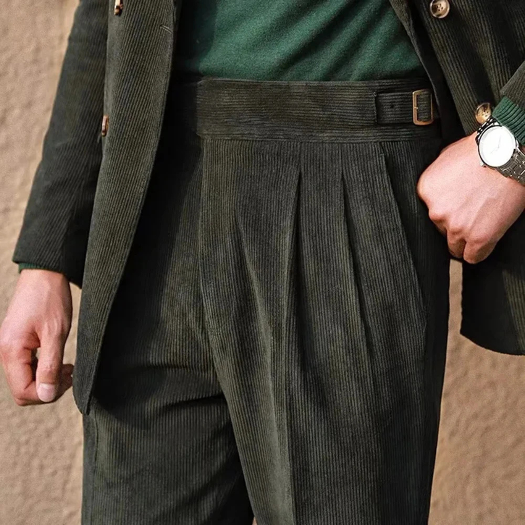 Green corduroy high-waisted pleated pants with side adjuster strap and belt loops