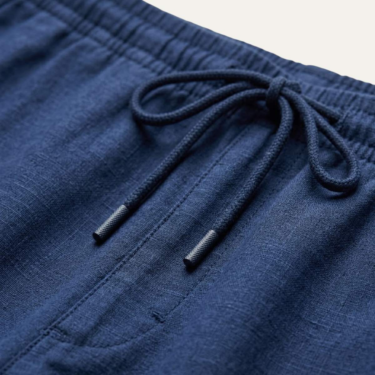 Hemp pants waistband close-up, navy drawstring and elastic band