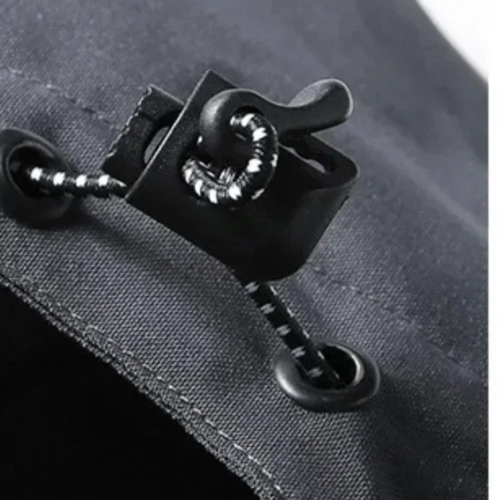 Black rain jacket toggle puller on waterproof zipper tape