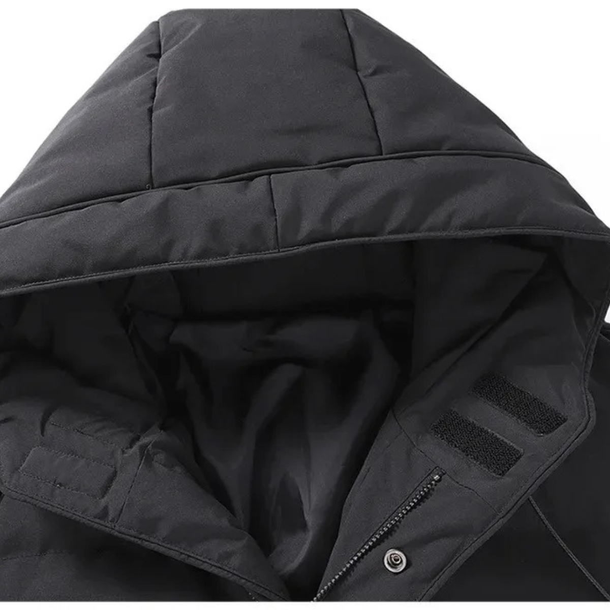 Black hooded puffer jacket close-up with lined collar and fabric texture