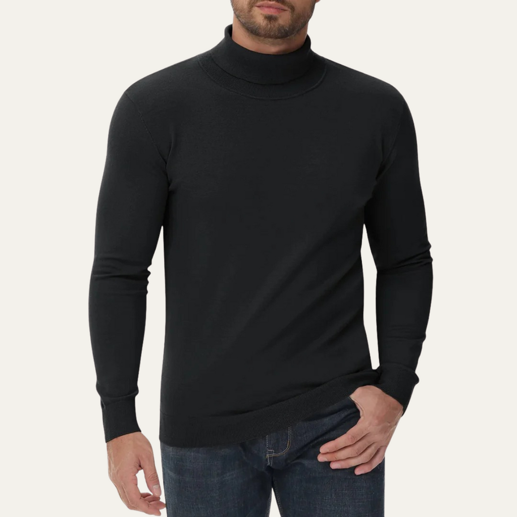 Men's black slim-fit cotton turtleneck sweater worn with jeans; ribbed cuffs.