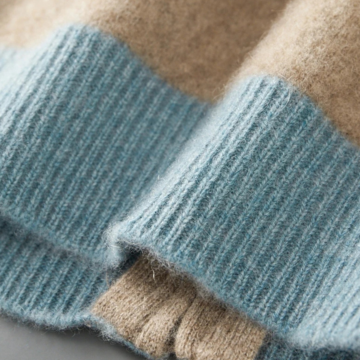 Men's cashmere zip-front sweater sleeve cuffs in light blue knit with ribbed trim