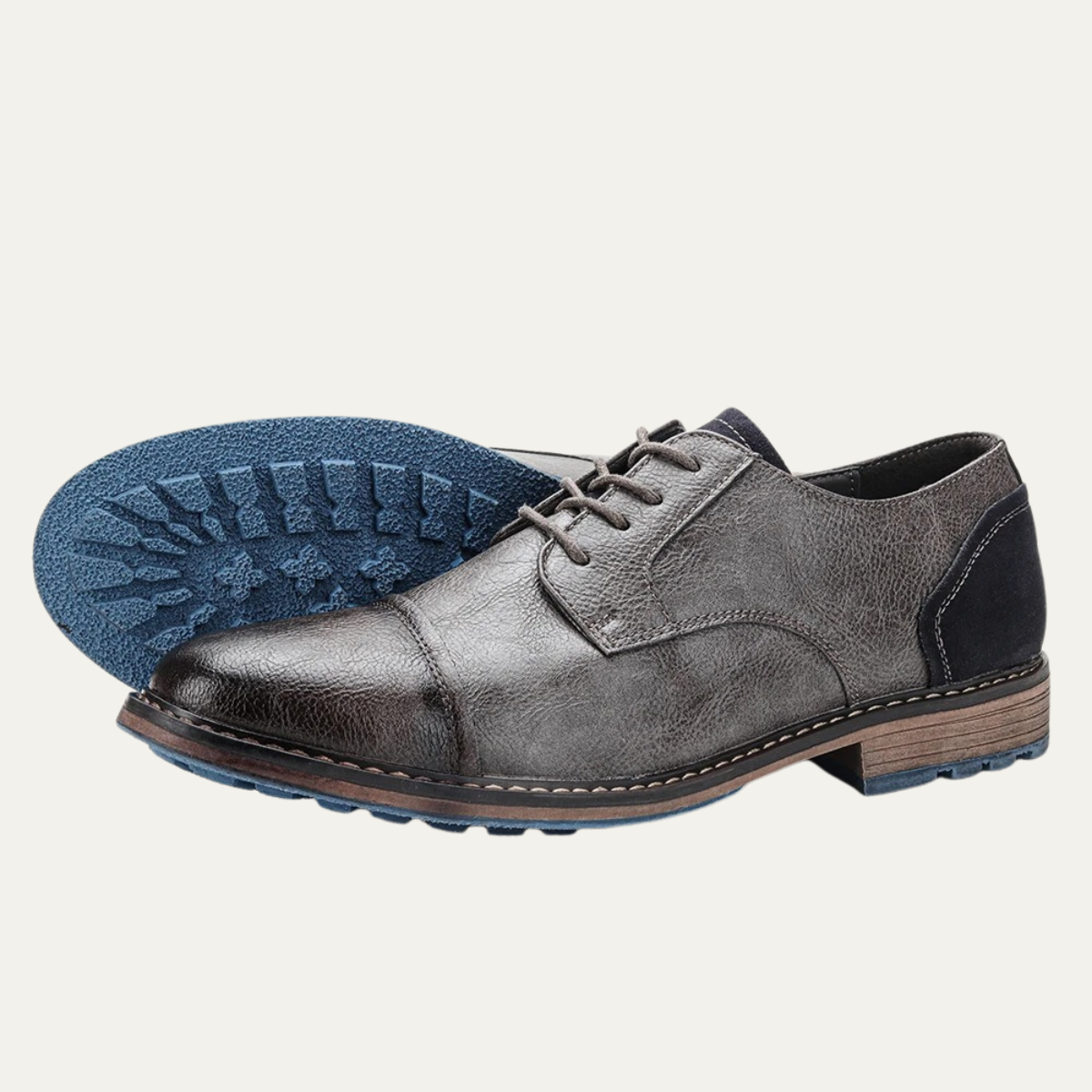 Men's lace-up leather Oxford shoe sole view, gray upper with blue tread outsole
