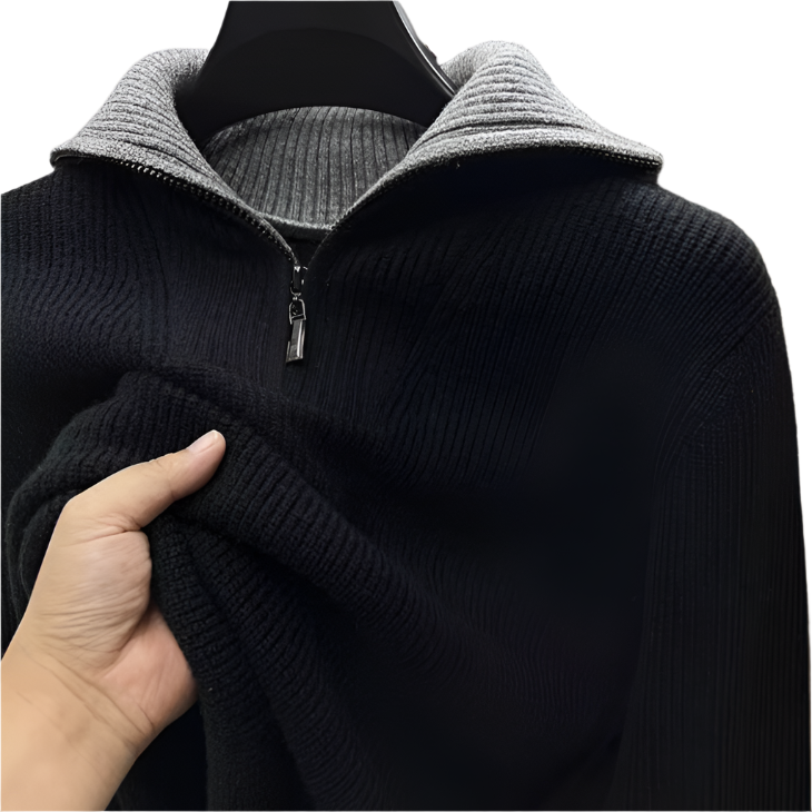 Close-up of men's quarter-zip sweater in black knit with visible metal zipper