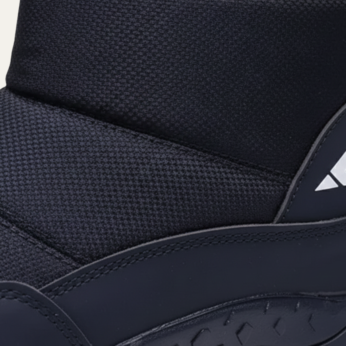 Men's insulated snow boots side panel with textured fabric and stitched edge trim