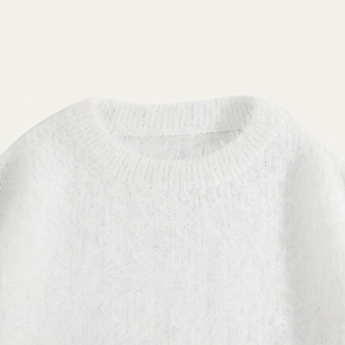 White crewneck cashmere sweater with ribbed neckline