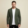 Men's army green lightweight jacket worn with a white T-shirt and black pants