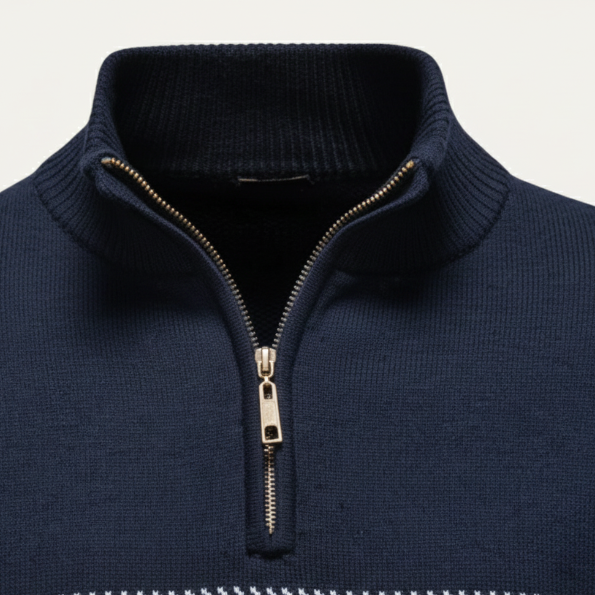 Navy knit half-zip sweater close-up with stand collar and metal zipper pull