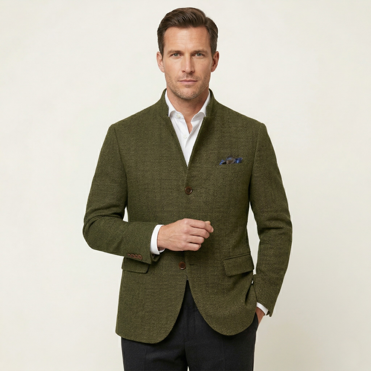 Men's olive green tweed blazer jacket with button front, flap pockets, and blue pocket square