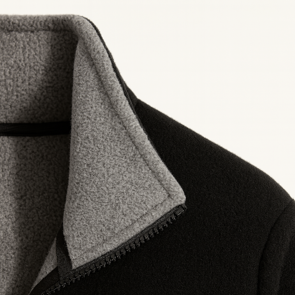 Gray fleece lining inside a zip-front outdoor jacket collar