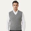 Men's gray textured knit V-neck sweater vest worn over a white button-down shirt
