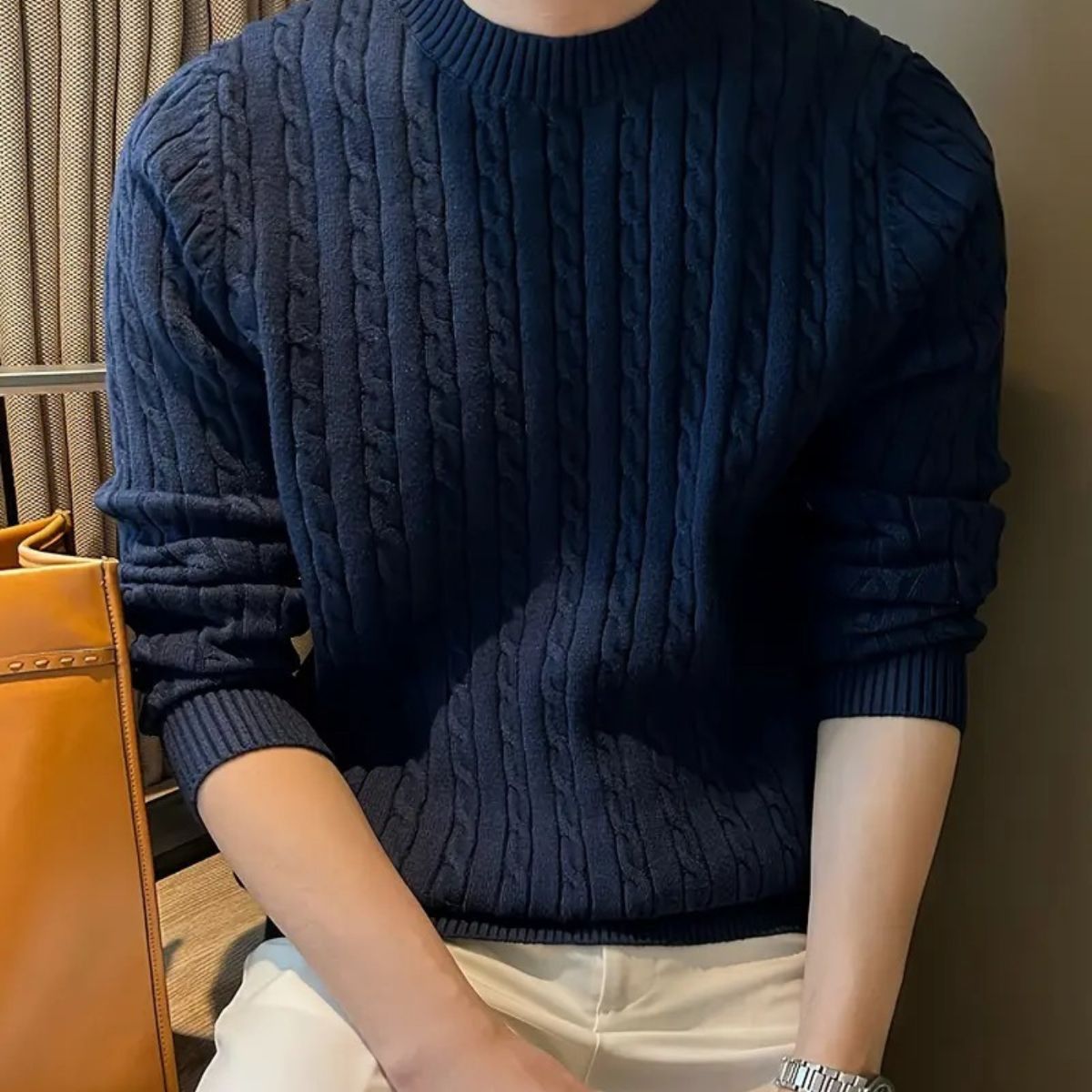 Navy cable-knit crewneck sweater with textured vertical cable pattern