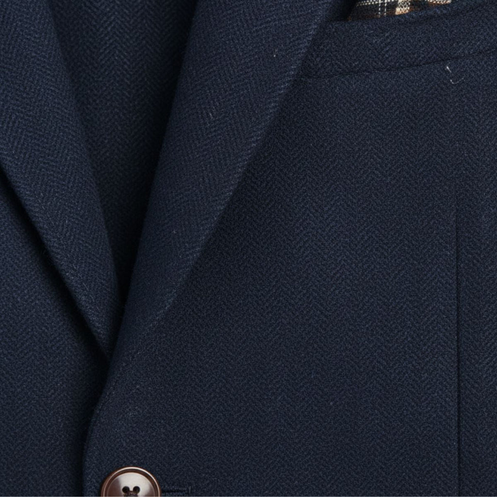 Navy blue herringbone wool blazer with single-breasted front and notch lapel