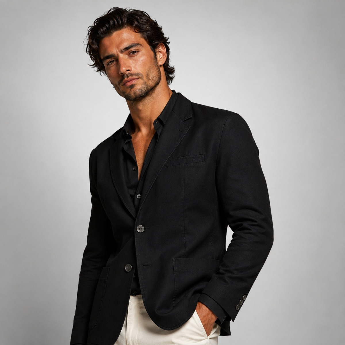 Men's black casual blazer jacket with notch lapels, button front, and chest pocket