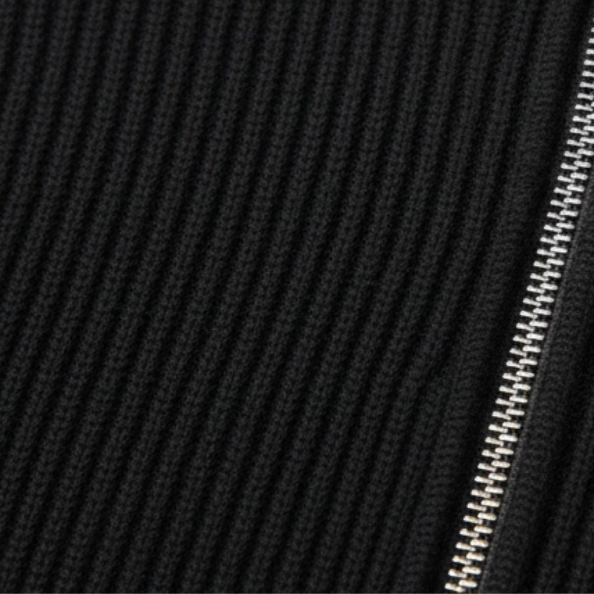 Black ribbed knit quarter-zip sweater close-up with zipper teeth