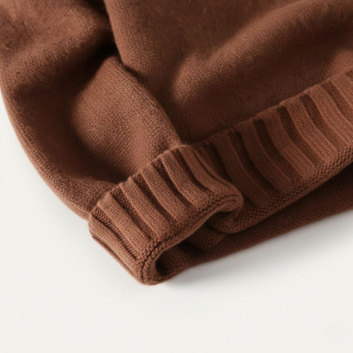 Men's soft knit turtleneck sweater, brown ribbed sleeve cuff close-up