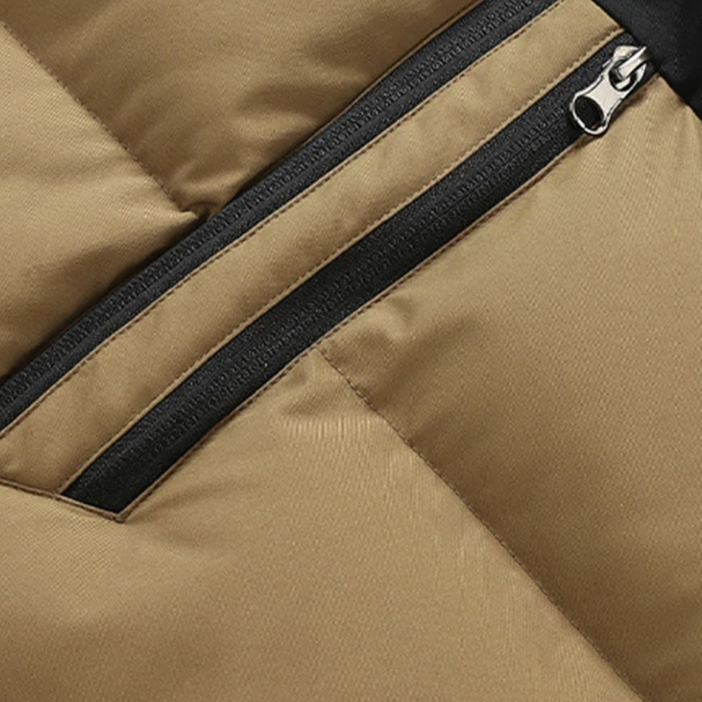 Khaki puffer vest detail: black zipper track with upper zip pocket