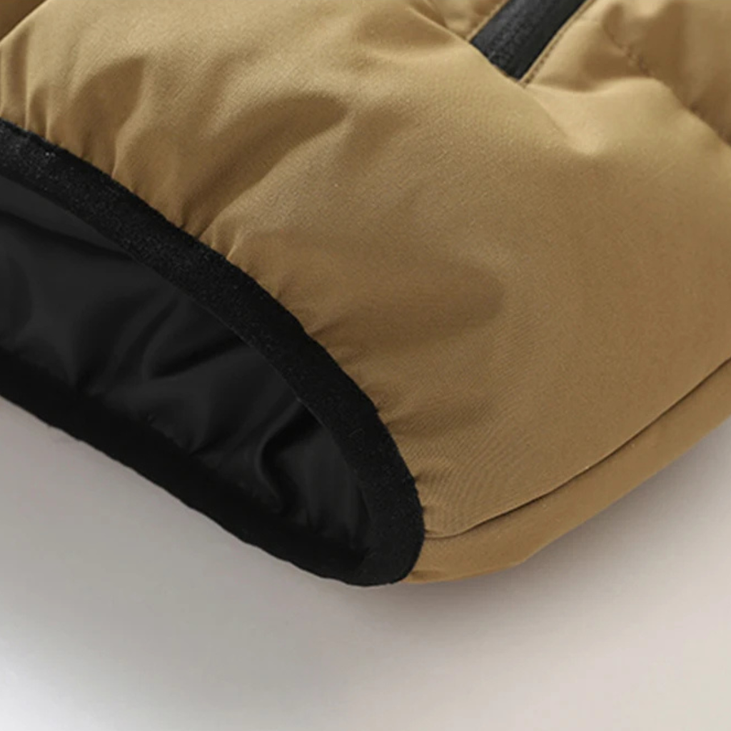 Khaki puffer vest hem with black inner lining and elastic edge