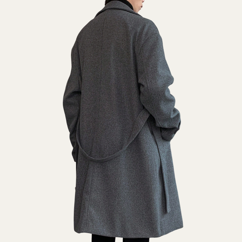 Gray wool overcoat back view with draped back and belt detail
