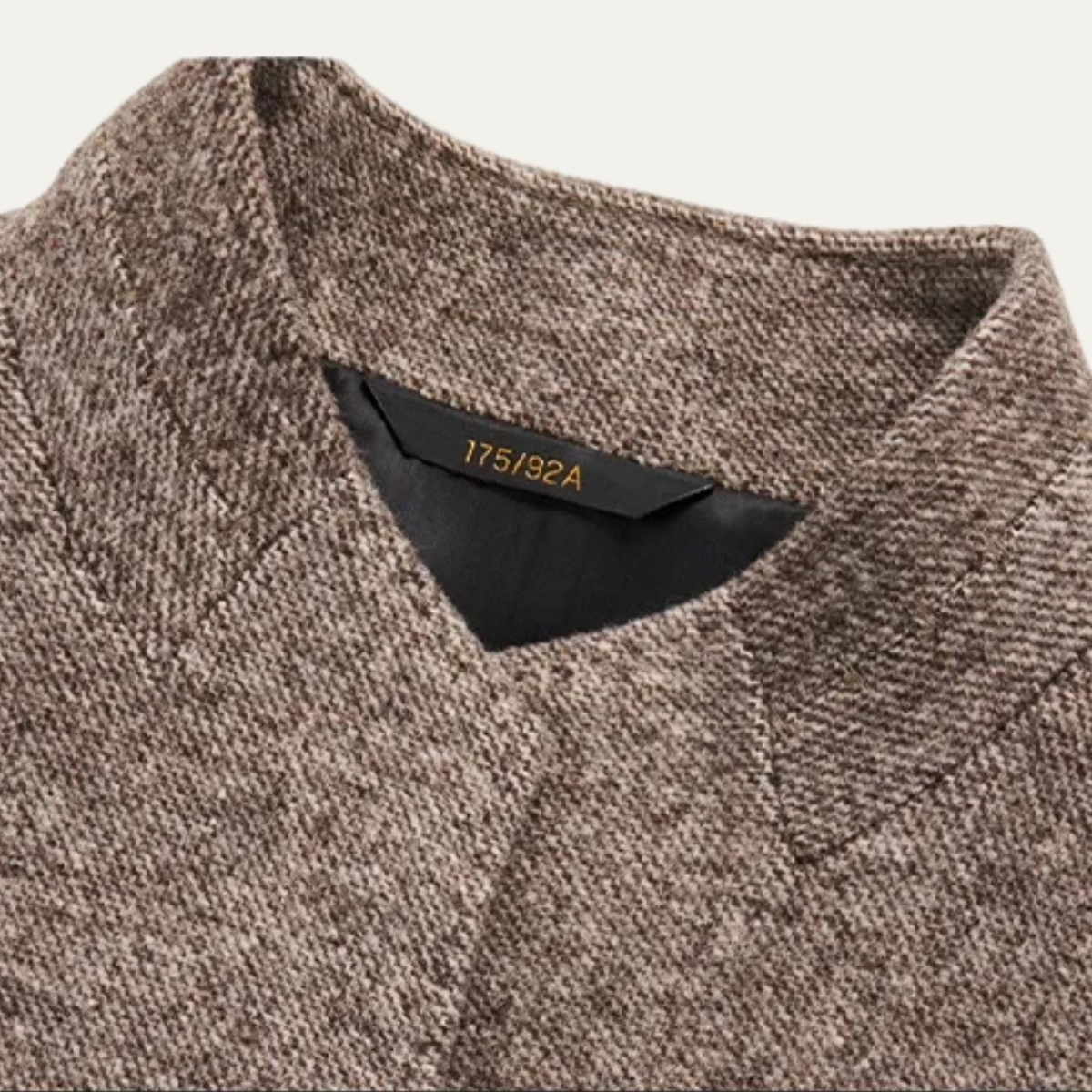 Men's warm fleece blazer, brown textured fabric close-up with stand collar neckline