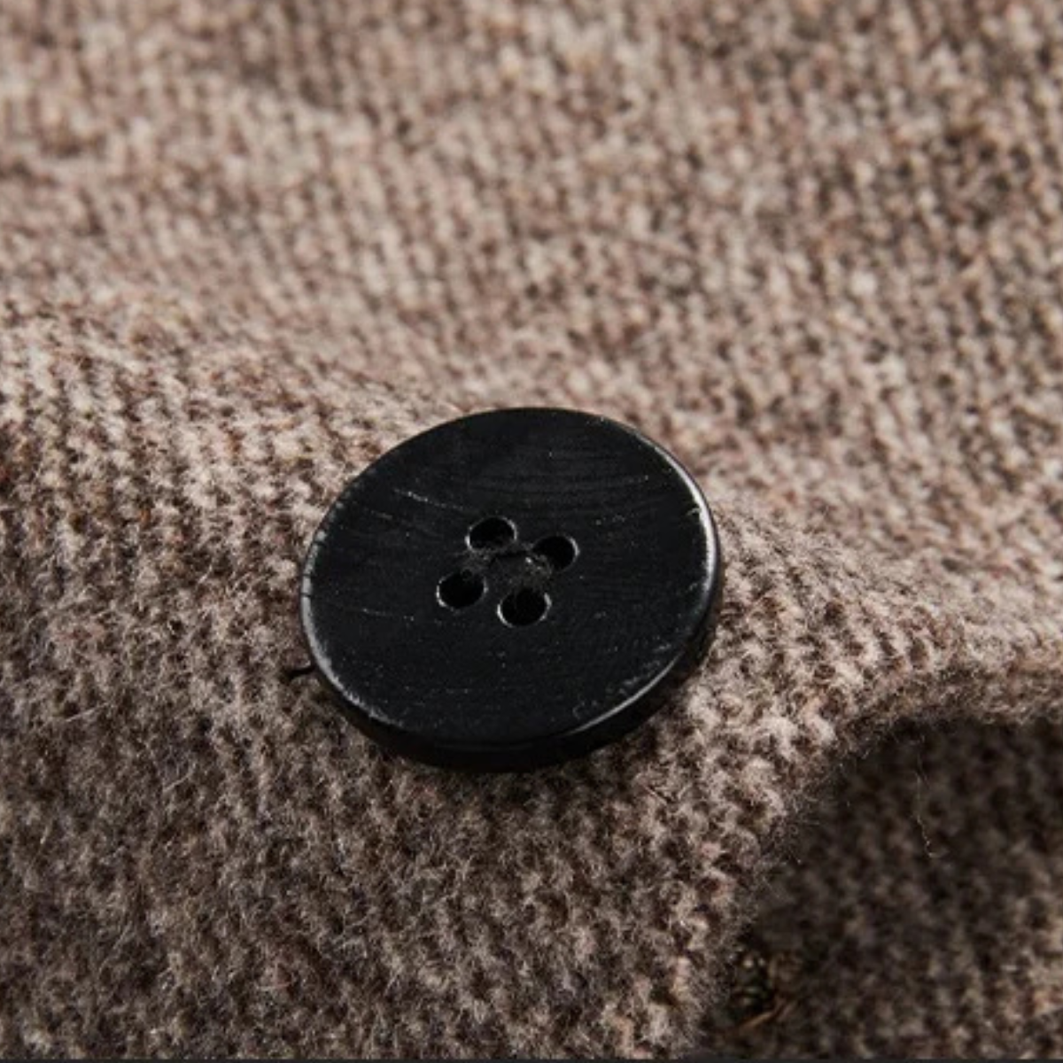 Men's warm fleece blazer button, black round snap button on brown textured fabric