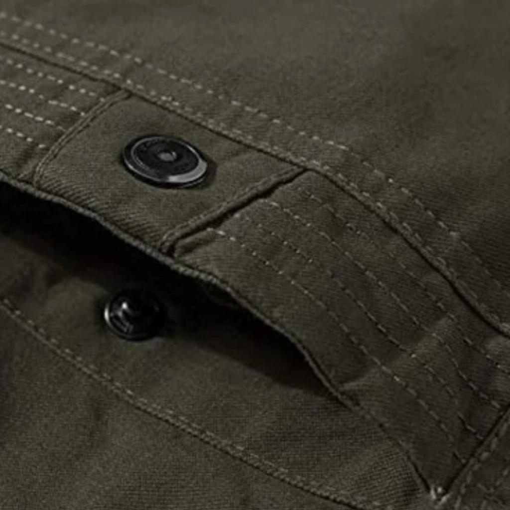 Dark green military zip jacket close-up with flap pockets and snap buttons