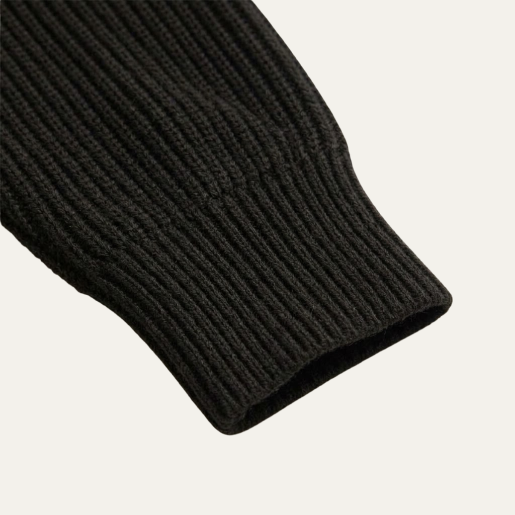 Men's merino wool half-zip sweater cuff, dark knitted sleeve hem