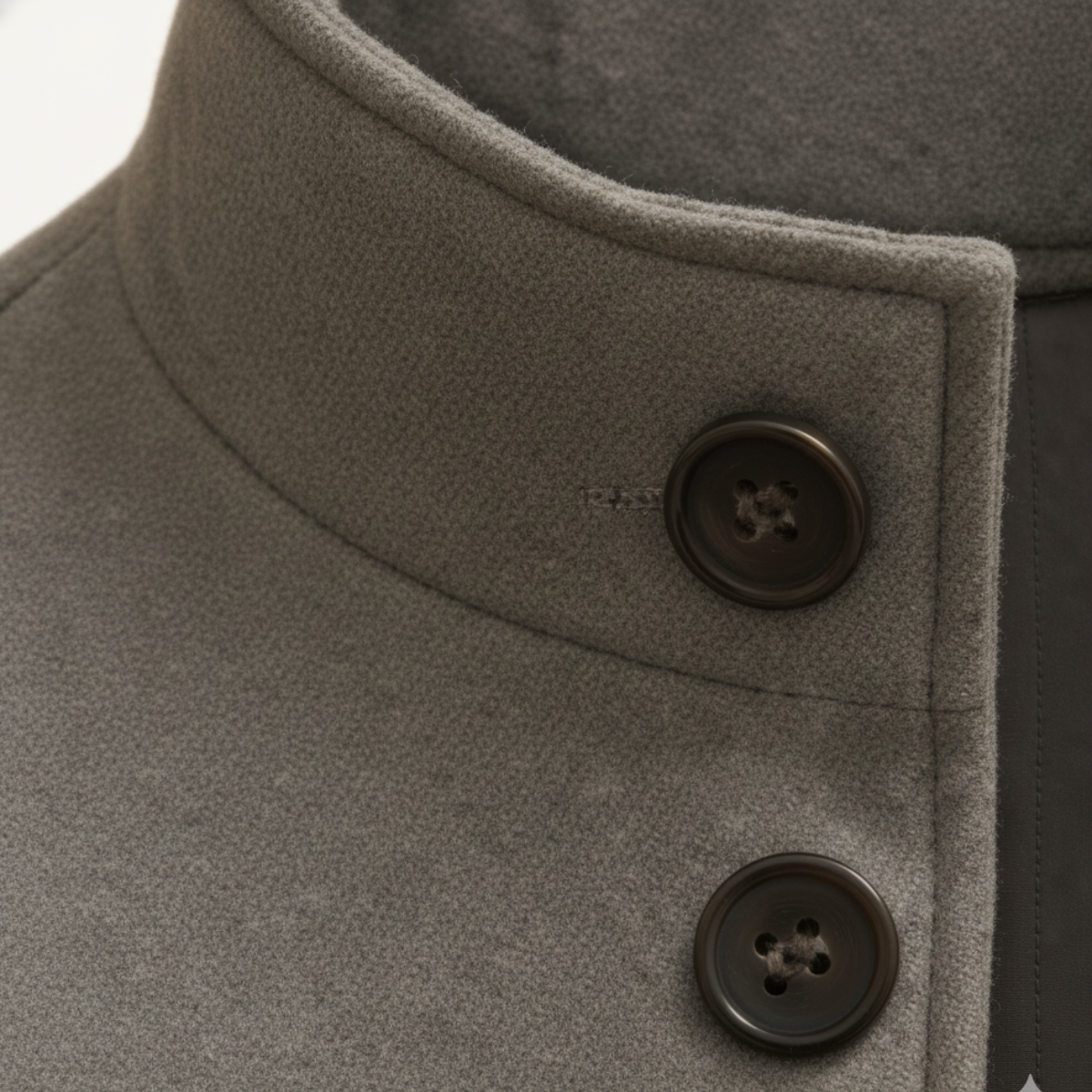 Men's gray wool overcoat close-up of stand collar and dark button placket