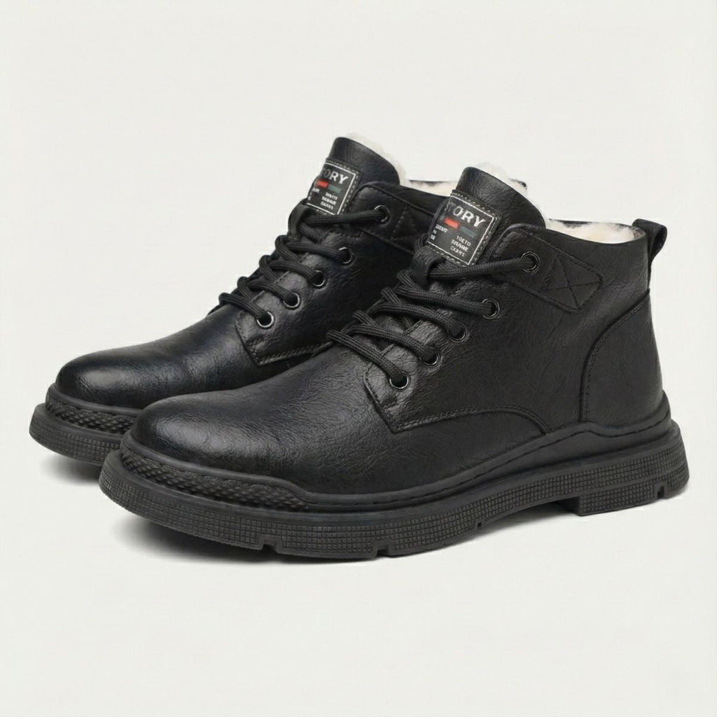 Black leather lace-up ankle snow boots, padded collar, and treaded rubber sole