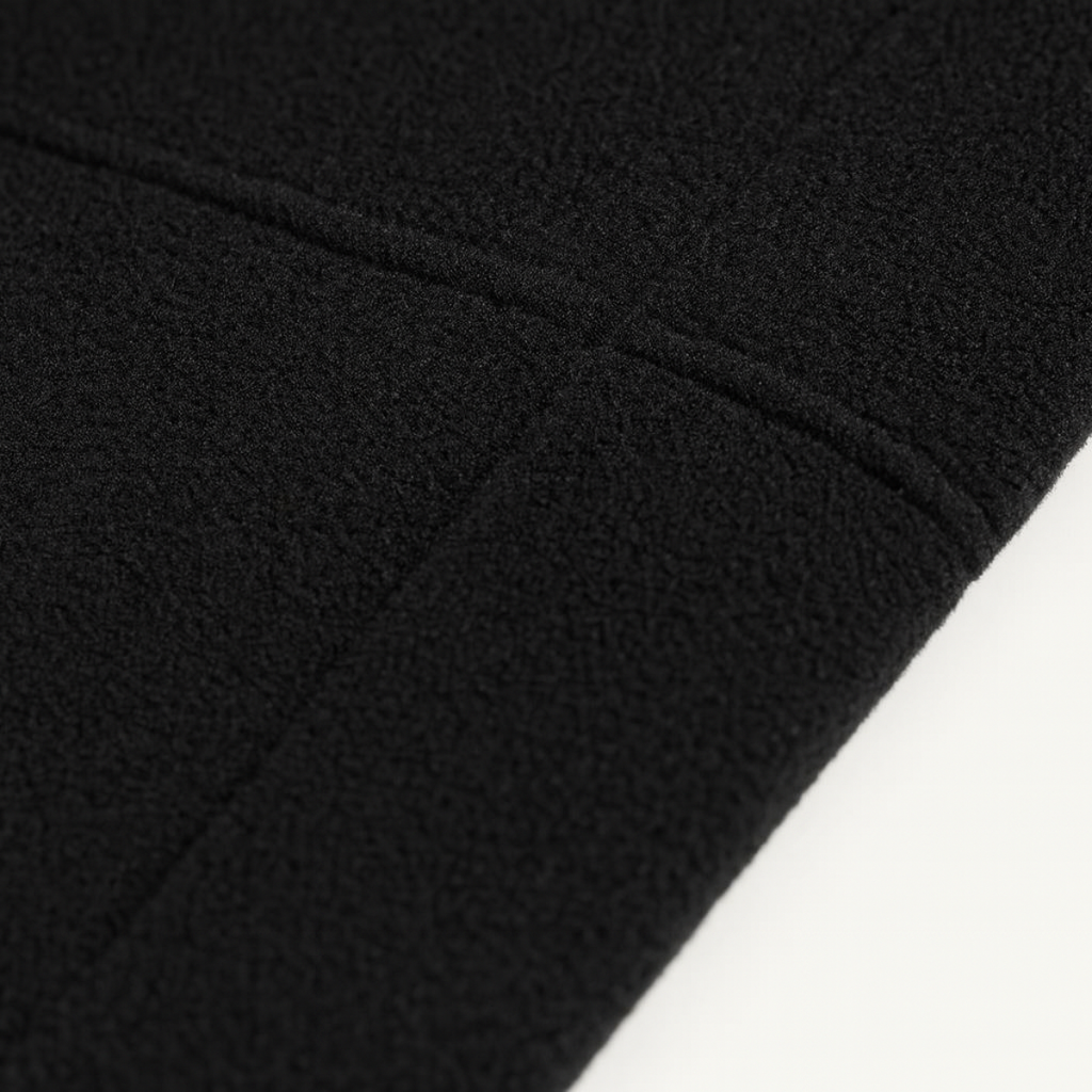 Close-up of black fleece fabric texture on a men's outdoor jacket