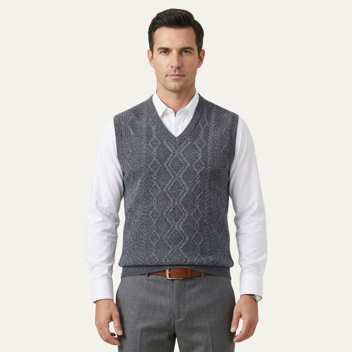 Men's light gray v-neck cable knit sweater vest over a white dress shirt.