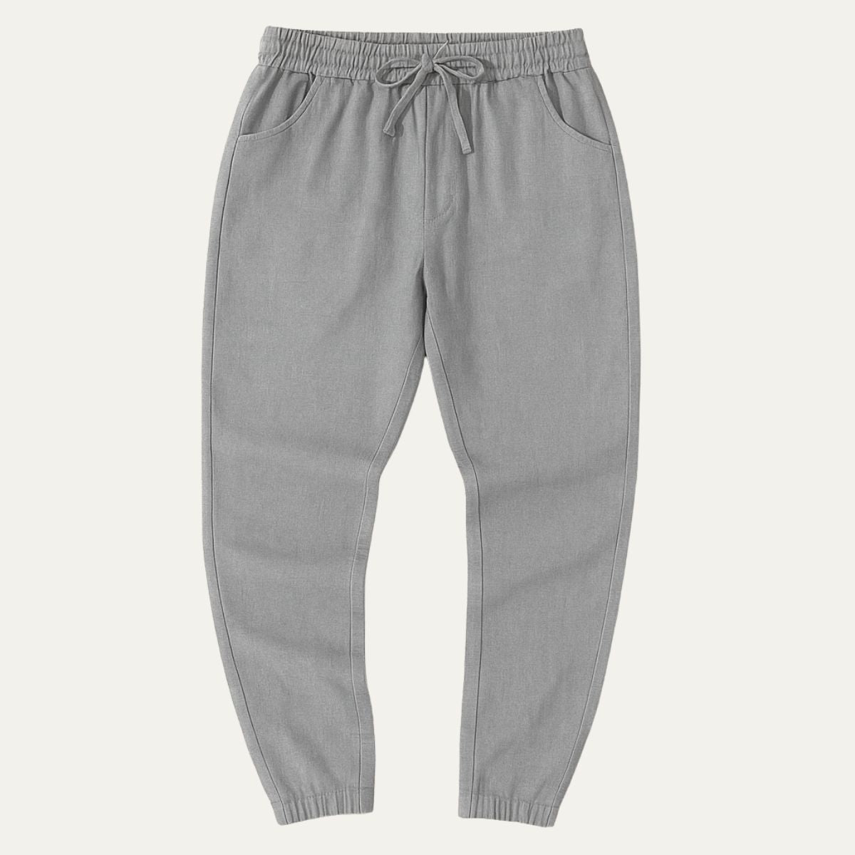 Gray cotton jogger pants with elastic waist, drawstring tie, and cuffed hems