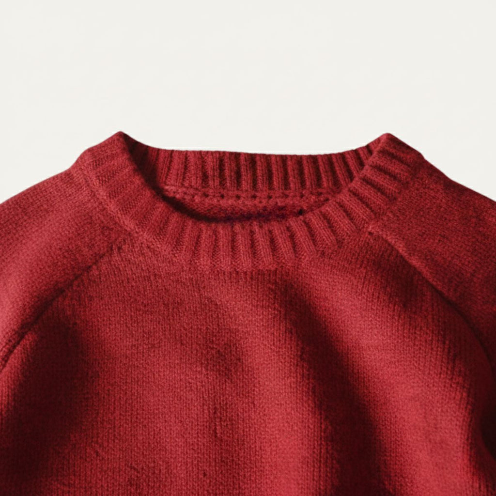 Red knit sweater neckline with ribbed crew collar and textured knit