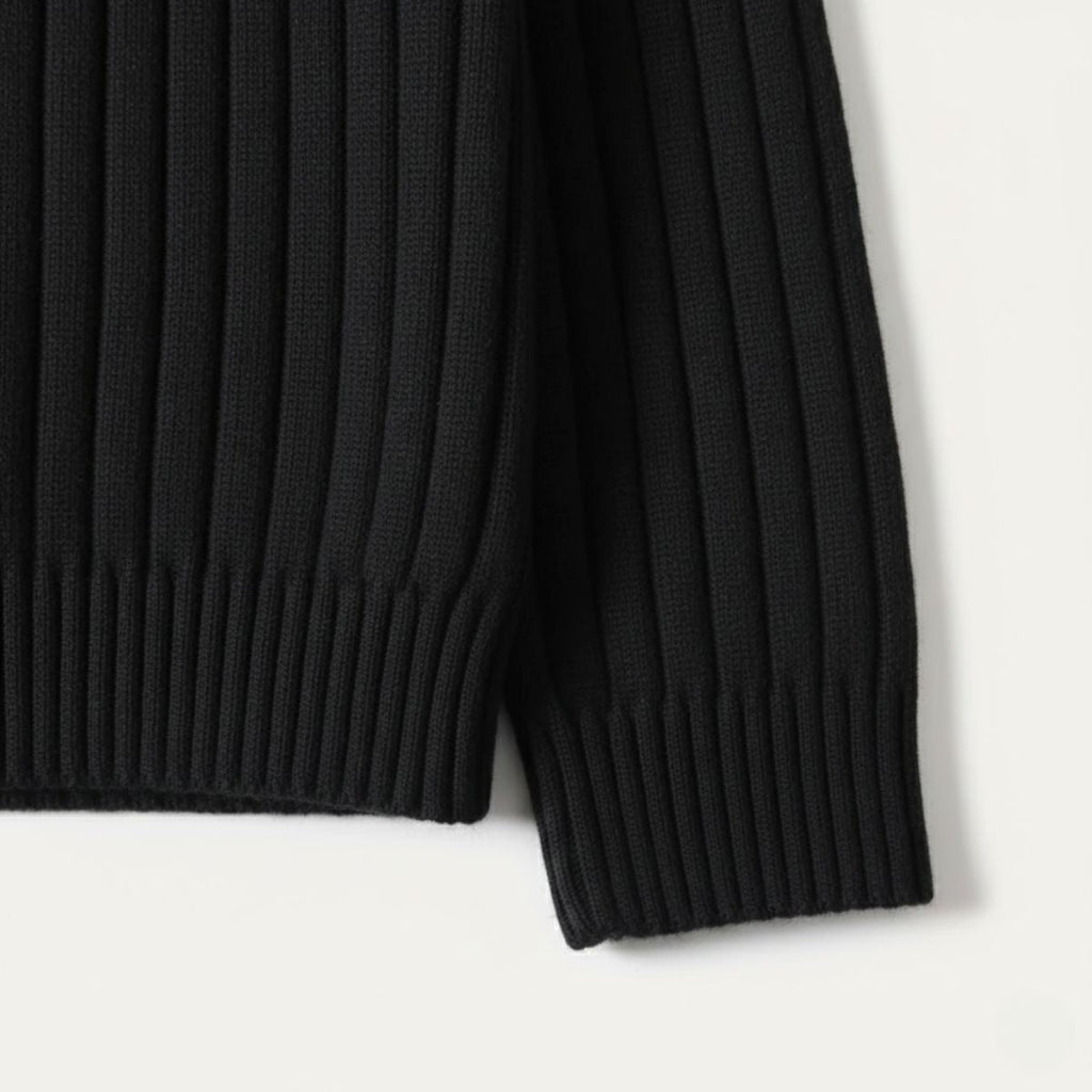 Black ribbed knit sweater hem and sleeve cuff detail