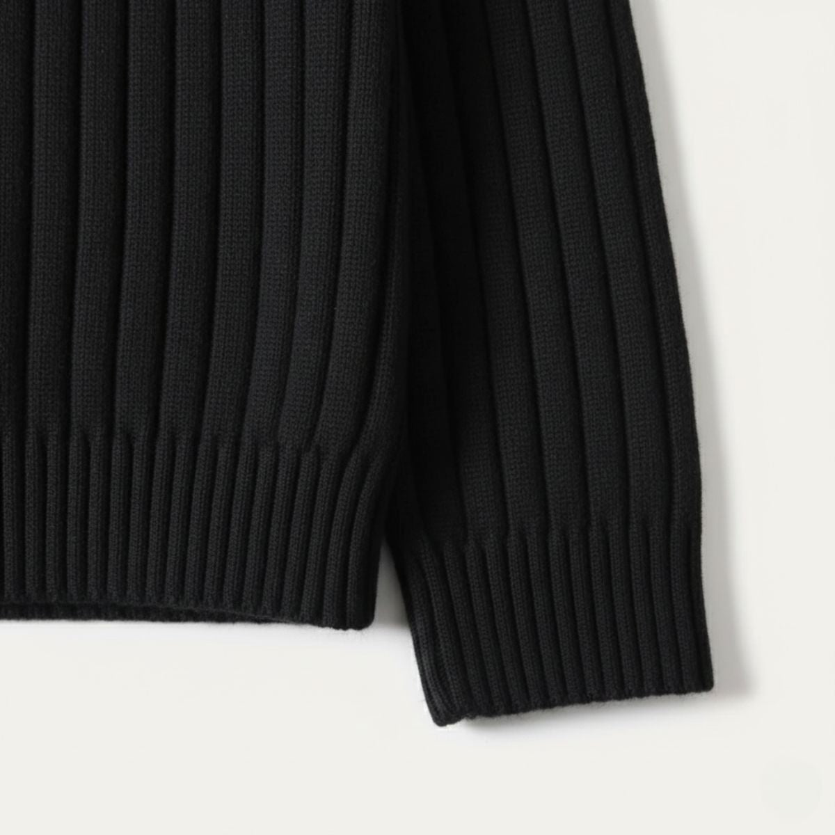 Black ribbed knit sweater hem and sleeve cuff detail