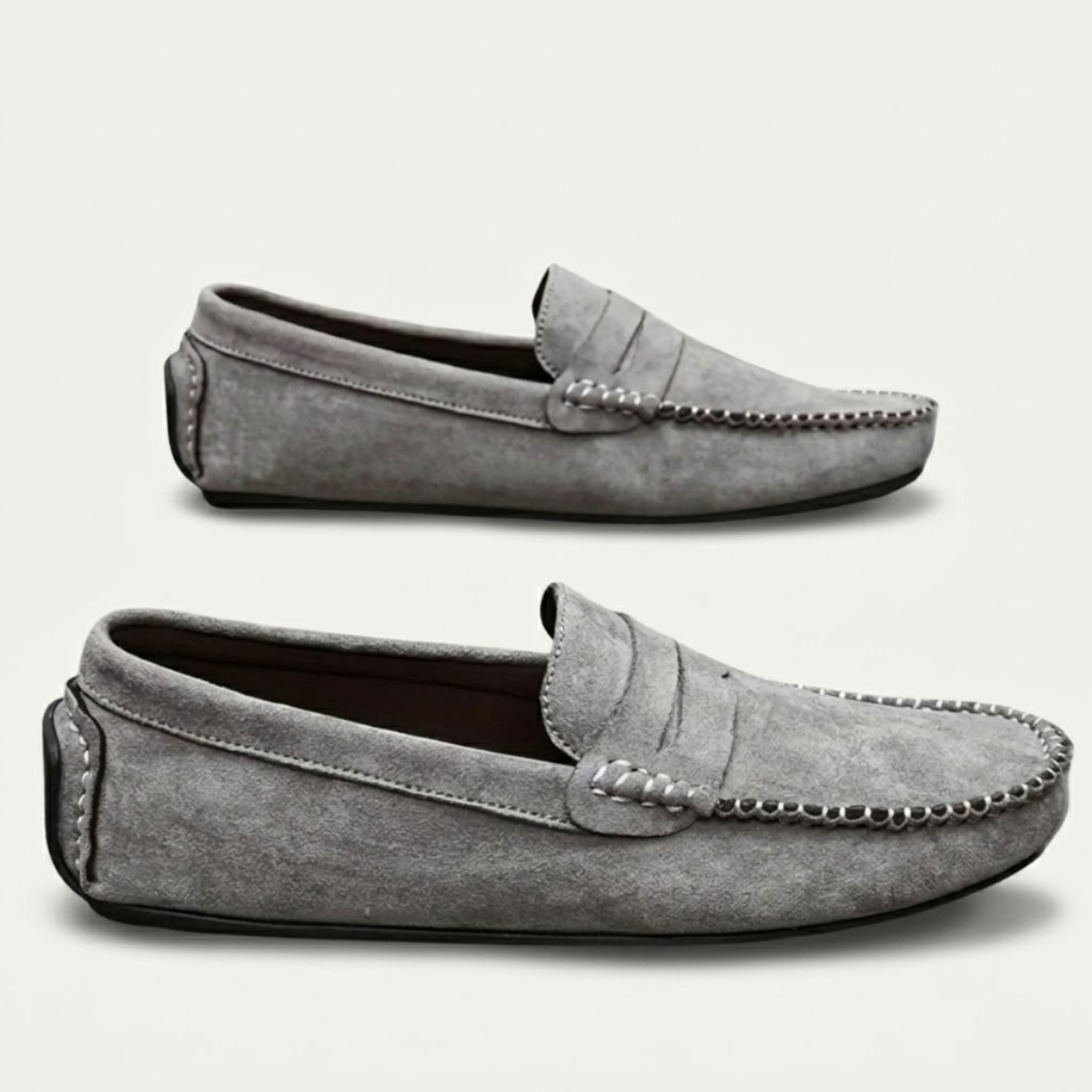 Gray suede moccasin loafers, slip-on with stitched moc seams and braided vamp detail.